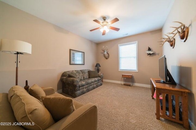1200 Choctaw Ridge Dr, Holts Summit, MO 65043 - living area with a ceiling fan, carpet flooring, and baseboards