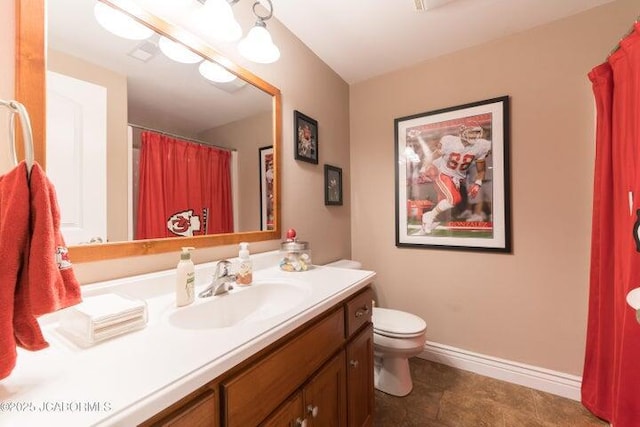 1200 Choctaw Ridge Dr, Holts Summit, MO 65043 - bathroom featuring vanity, toilet, and baseboards