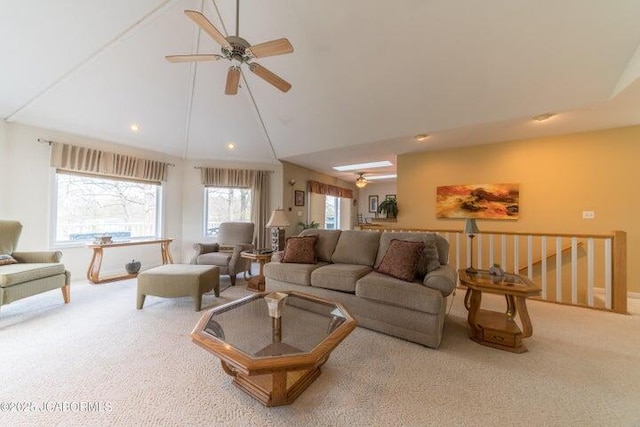 living area with ceiling fan, carpet floors, recessed lighting, and lofted ceiling