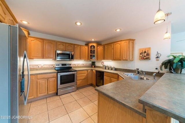 kitchen featuring appliances with stainless steel finishes, a sink, a peninsula, glass insert cabinets, and light tile patterned floors