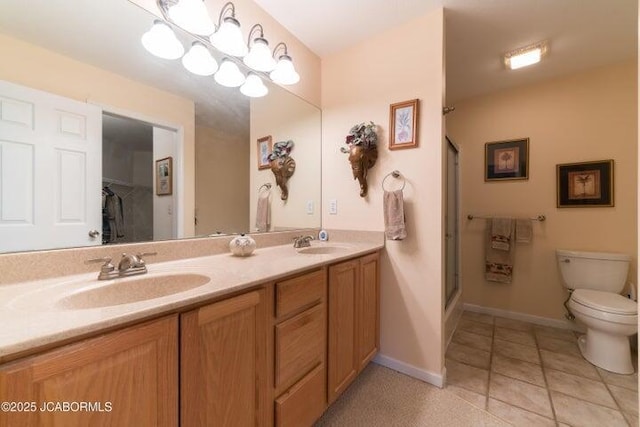 full bathroom with toilet, a shower with door, tile patterned floors, baseboards, and double vanity
