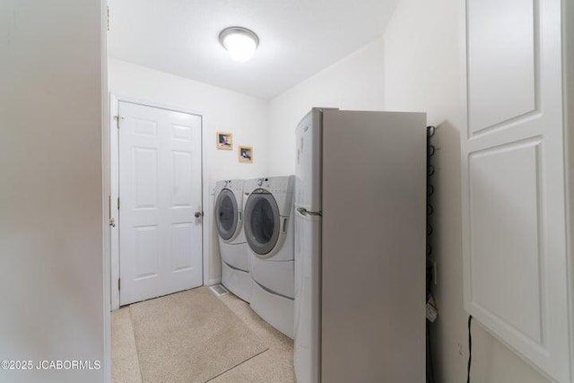 laundry area with washing machine and dryer