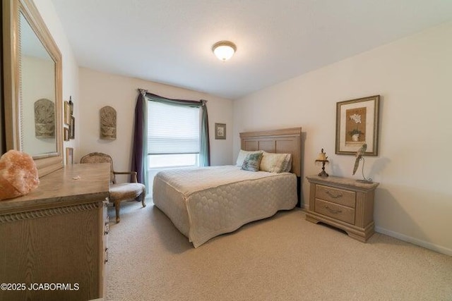 bedroom featuring light carpet