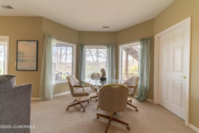 dining area with carpet and baseboards