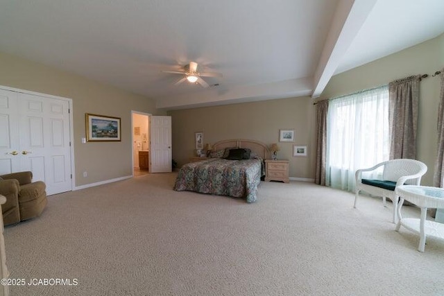 carpeted bedroom featuring baseboards and a ceiling fan