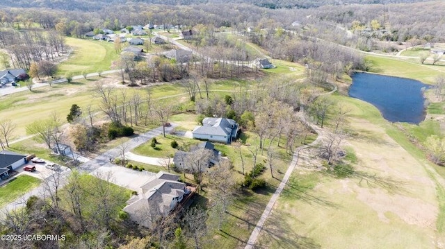aerial view of property's location with a large body of water