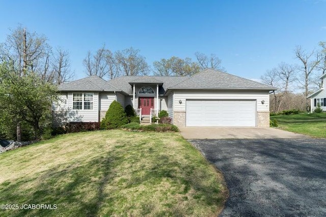 single story home featuring asphalt driveway, a garage, brick siding, and a front lawn