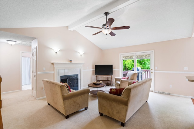 2313 Katy Ln, Columbia, MO 65203 - living area with light carpet, ceiling fan, a tiled fireplace, and baseboards