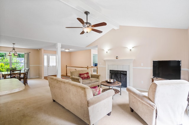 2313 Katy Ln, Columbia, MO 65203 - living room with light carpet, ceiling fan, baseboards, and a tiled fireplace