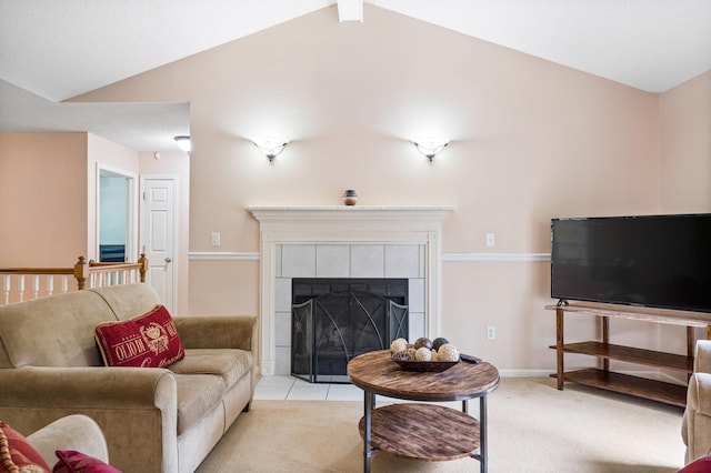 2313 Katy Ln, Columbia, MO 65203 - living room featuring vaulted ceiling, light carpet, and a tile fireplace