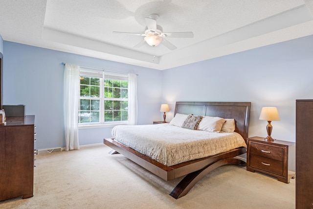2313 Katy Ln, Columbia, MO 65203 - bedroom with a tray ceiling, carpet flooring, baseboards, and ceiling fan