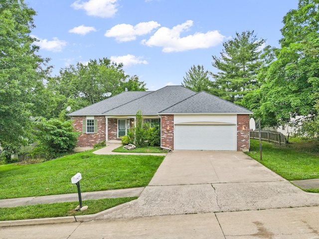 2313 Katy Ln, Columbia, MO 65203 - view of front of home featuring a garage, driveway, brick siding, and a shingled roof