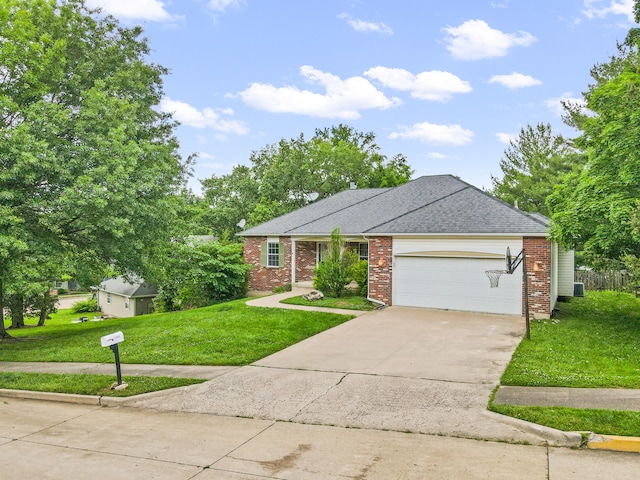 2313 Katy Ln, Columbia, MO 65203 - view of front of property with brick siding, a front lawn, an attached garage, driveway, and a shingled roof