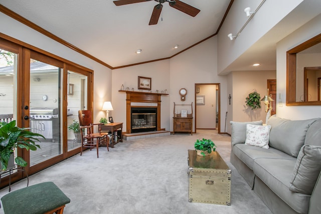2512 Cimarron Dr, Columbia, MO 65203 - living area with crown molding, carpet flooring, vaulted ceiling, a ceiling fan, and a fireplace