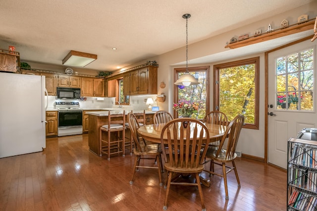 2512 Cimarron Dr, Columbia, MO 65203 - dining room with healthy amount of natural light and hardwood / wood-style floors