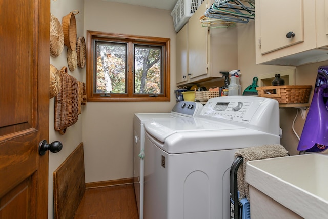 2512 Cimarron Dr, Columbia, MO 65203 - laundry room with washing machine and dryer, cabinet space, wood finished floors, and baseboards