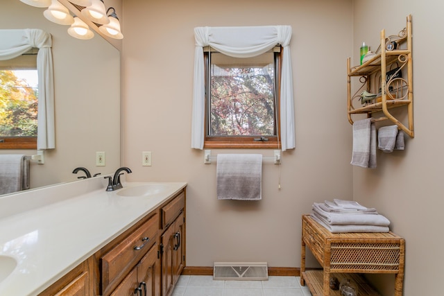 2512 Cimarron Dr, Columbia, MO 65203 - full bath featuring double vanity, baseboards, and tile patterned flooring