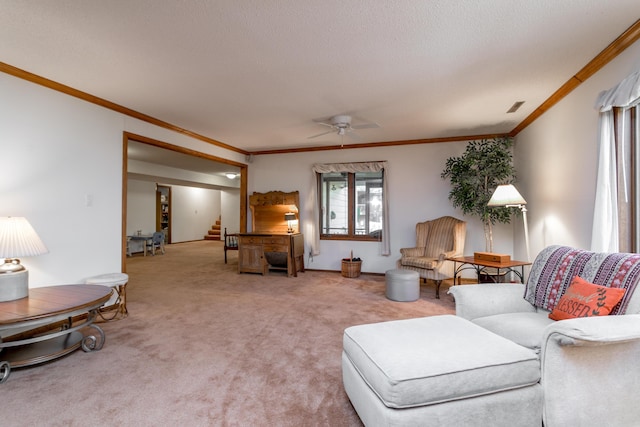 2512 Cimarron Dr, Columbia, MO 65203 - carpeted living room with stairway, a ceiling fan, and crown molding