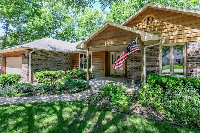 2512 Cimarron Dr, Columbia, MO 65203 - view of front of property featuring brick siding and an attached garage
