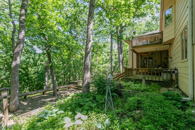 2512 Cimarron Dr, Columbia, MO 65203 - view of yard with a wooden deck, a balcony, and ceiling fan