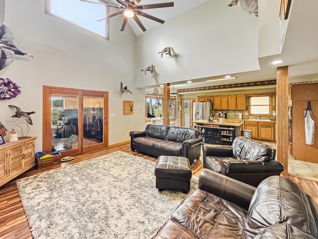 7495 E Schooler Rd, Centralia, MO 65240 - living area featuring ceiling fan, healthy amount of natural light, and a towering ceiling
