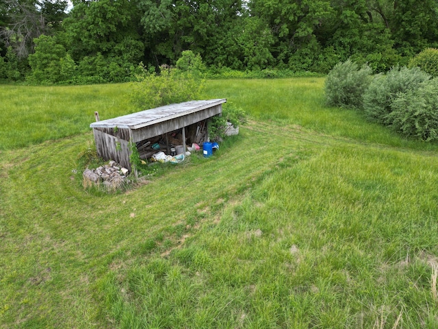 7495 E Schooler Rd, Centralia, MO 65240 - view of yard with an outdoor structure, an outbuilding, and a forest view