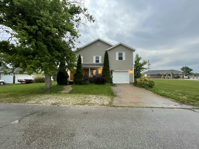 305 Jefferson St, Macon, MO 63552 - view of front of property featuring asphalt driveway, an attached garage, and a front yard