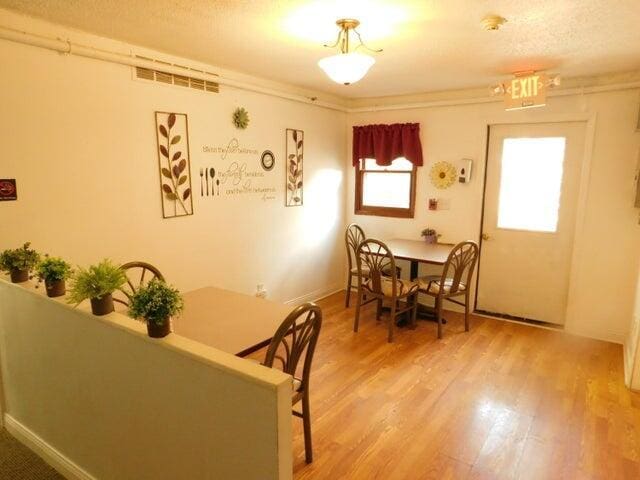 dining space with light wood-type flooring