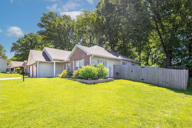 1050 Azoros Dr, Columbia, MO 65203 - view of front of home featuring an attached garage, brick siding, and a gate