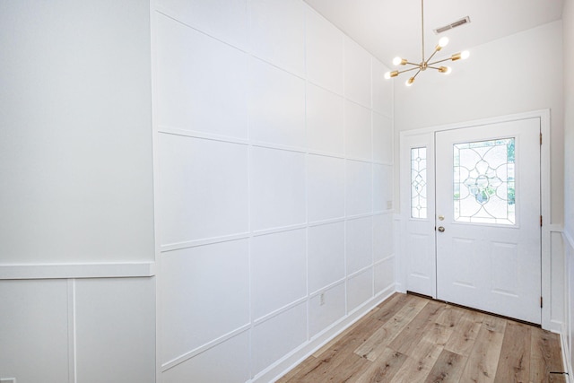1050 Azoros Dr, Columbia, MO 65203 - entryway featuring a chandelier, light wood-type flooring, and lofted ceiling