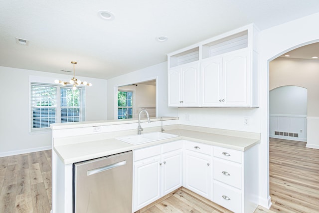 1050 Azoros Dr, Columbia, MO 65203 - kitchen with a sink, stainless steel dishwasher, arched walkways, light wood finished floors, and recessed lighting