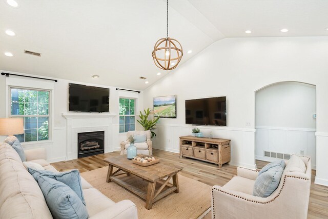 1050 Azoros Dr, Columbia, MO 65203 - living area with a wainscoted wall, plenty of natural light, recessed lighting, light wood-style floors, and high vaulted ceiling