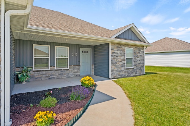 5111 Democracy Dr, Ashland, MO 65010 - entrance to property featuring board and batten siding, stone siding, a shingled roof, and a porch