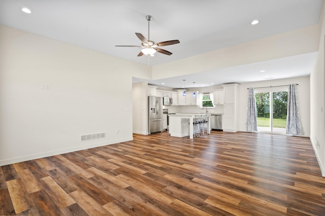 5111 Democracy Dr, Ashland, MO 65010 - unfurnished living room featuring dark wood-style floors, ceiling fan, recessed lighting, and baseboards