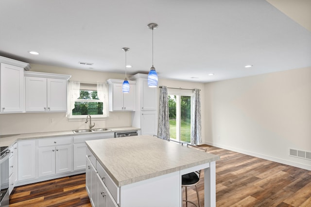 5111 Democracy Dr, Ashland, MO 65010 - kitchen featuring a sink, plenty of natural light, white cabinets, recessed lighting, and light countertops