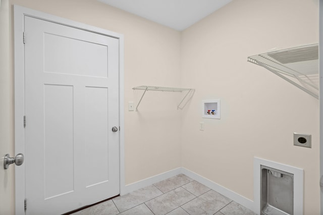 5111 Democracy Dr, Ashland, MO 65010 - laundry room featuring washer hookup, electric dryer hookup, baseboards, and light tile patterned floors