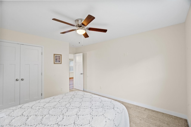 5111 Democracy Dr, Ashland, MO 65010 - bedroom featuring carpet floors, a closet, baseboards, and ceiling fan