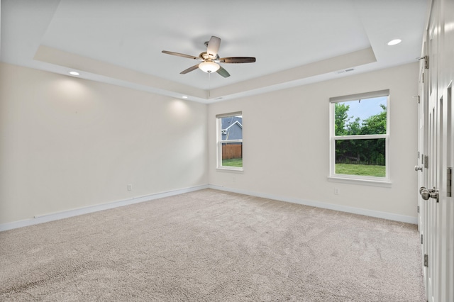 5111 Democracy Dr, Ashland, MO 65010 - empty room featuring a raised ceiling, a ceiling fan, baseboards, light colored carpet, and recessed lighting