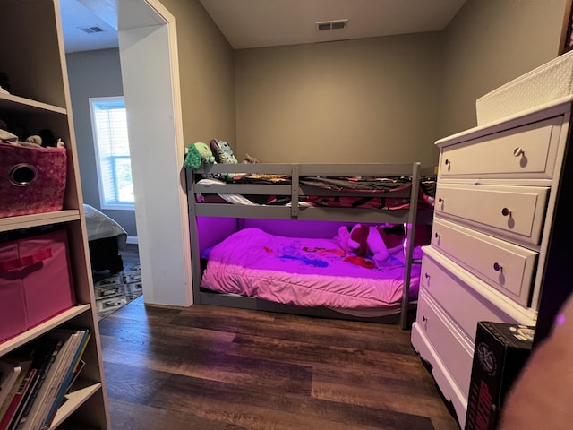5100 E Dunbar Ln, Centralia, MO 65240 - bedroom featuring dark wood-type flooring