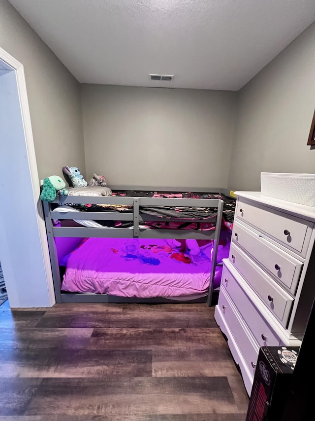 5100 E Dunbar Ln, Centralia, MO 65240 - bedroom featuring dark wood-style floors