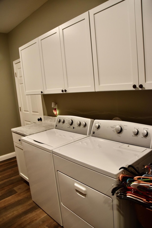 5100 E Dunbar Ln, Centralia, MO 65240 - laundry room with washing machine and dryer, cabinet space, dark wood-style floors, and baseboards