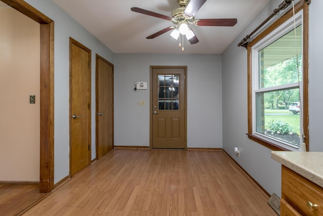 1804 N Pin Oak Blvd, Columbia, MO 65202 - foyer featuring light wood-type flooring, ceiling fan, and baseboards