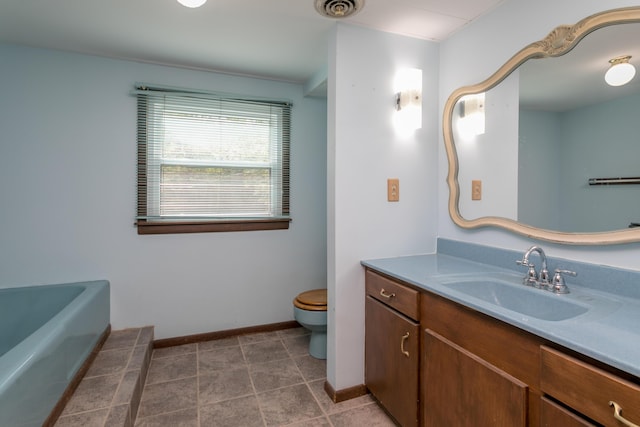 1804 N Pin Oak Blvd, Columbia, MO 65202 - full bathroom featuring toilet, vanity, a tub, and baseboards