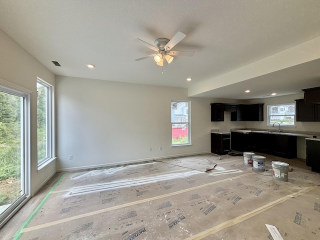 2505 Nest Ct, Columbia, MO 65202 - unfurnished living room featuring a sink, a ceiling fan, baseboards, and recessed lighting