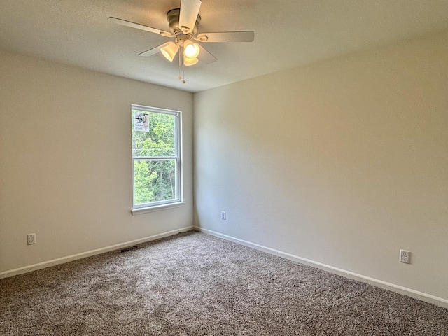2505 Nest Ct, Columbia, MO 65202 - carpeted spare room featuring a ceiling fan and baseboards