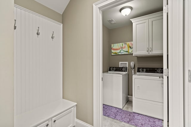 1732 Linkside Dr, Columbia, MO 65201 - washroom featuring separate washer and dryer, cabinet space, light tile patterned floors, and baseboards