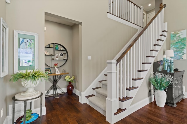 1732 Linkside Dr, Columbia, MO 65201 - stairs with wood finished floors, baseboards, and a towering ceiling
