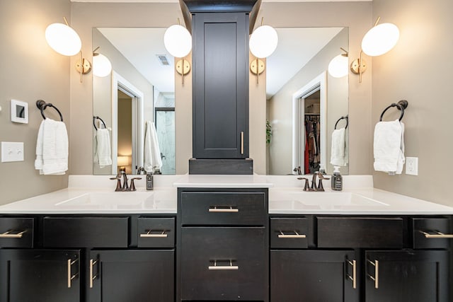 1043 Shore Acres, Columbia, MO 65201 - bathroom featuring double vanity, a spacious closet, and a shower