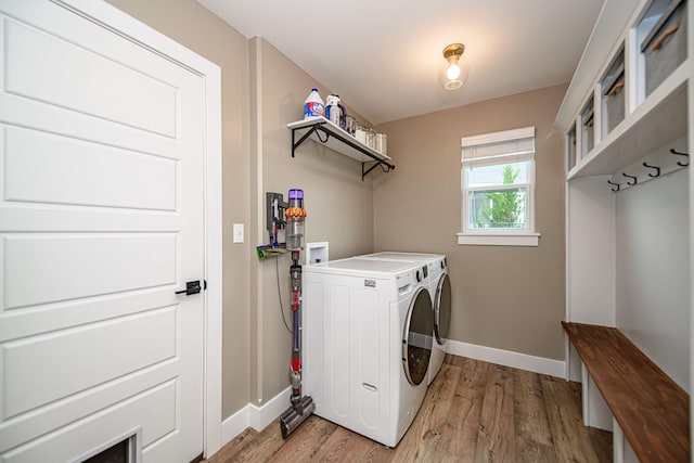 1043 Shore Acres, Columbia, MO 65201 - washroom featuring separate washer and dryer, baseboards, and light wood-style floors