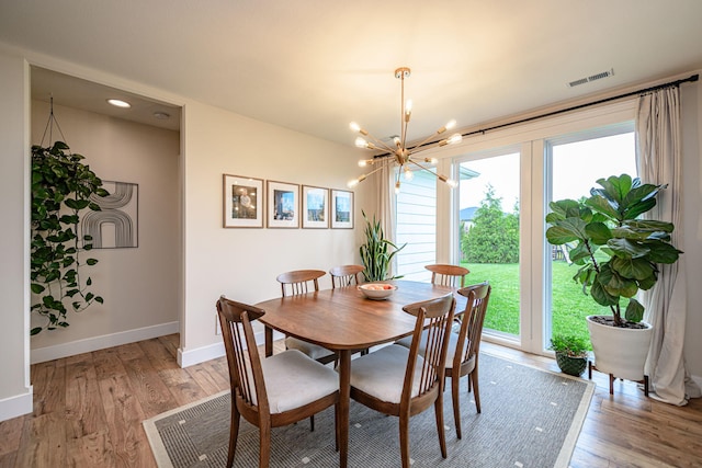 1043 Shore Acres, Columbia, MO 65201 - dining space with healthy amount of natural light, baseboards, a chandelier, and recessed lighting